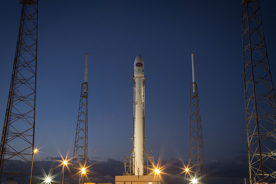A rocket on a launch pad at dusk